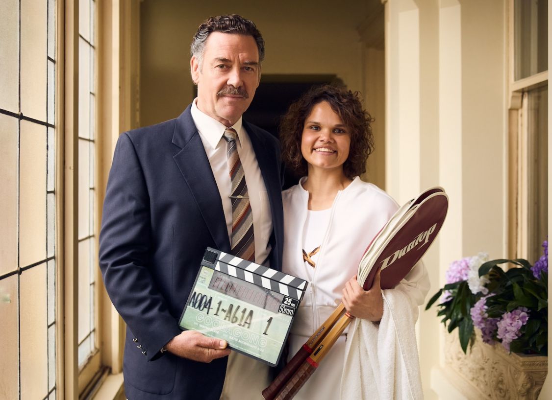 man and woman smiling at camera