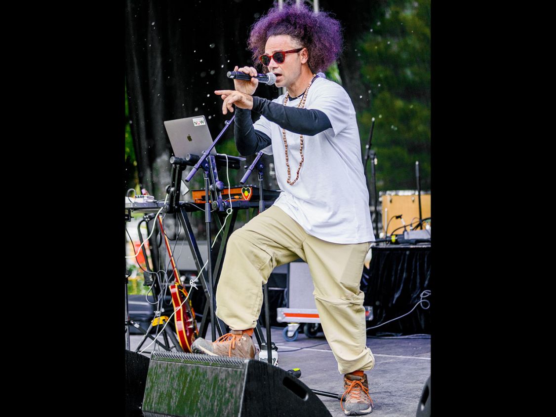 Man on stage performing to a crowd