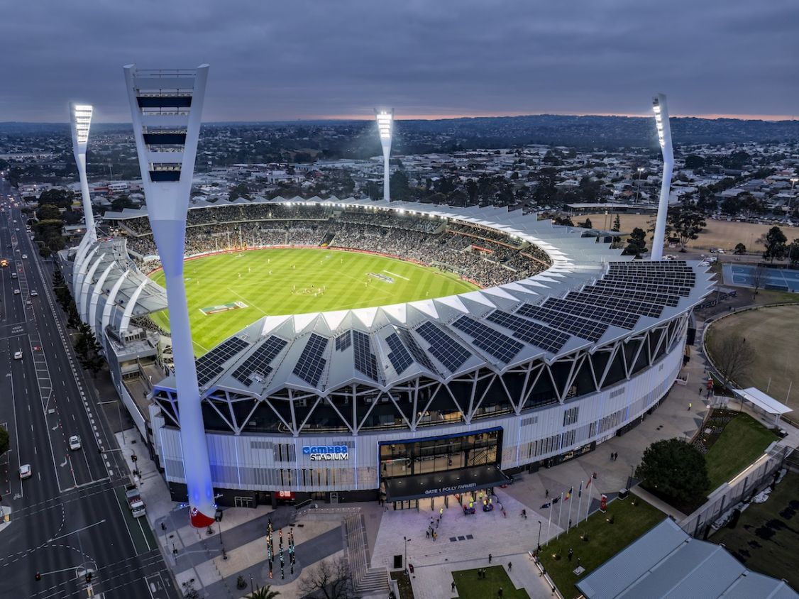 drone shot of stadium lit up