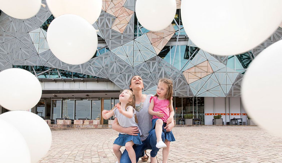 woman with two kids at fed square