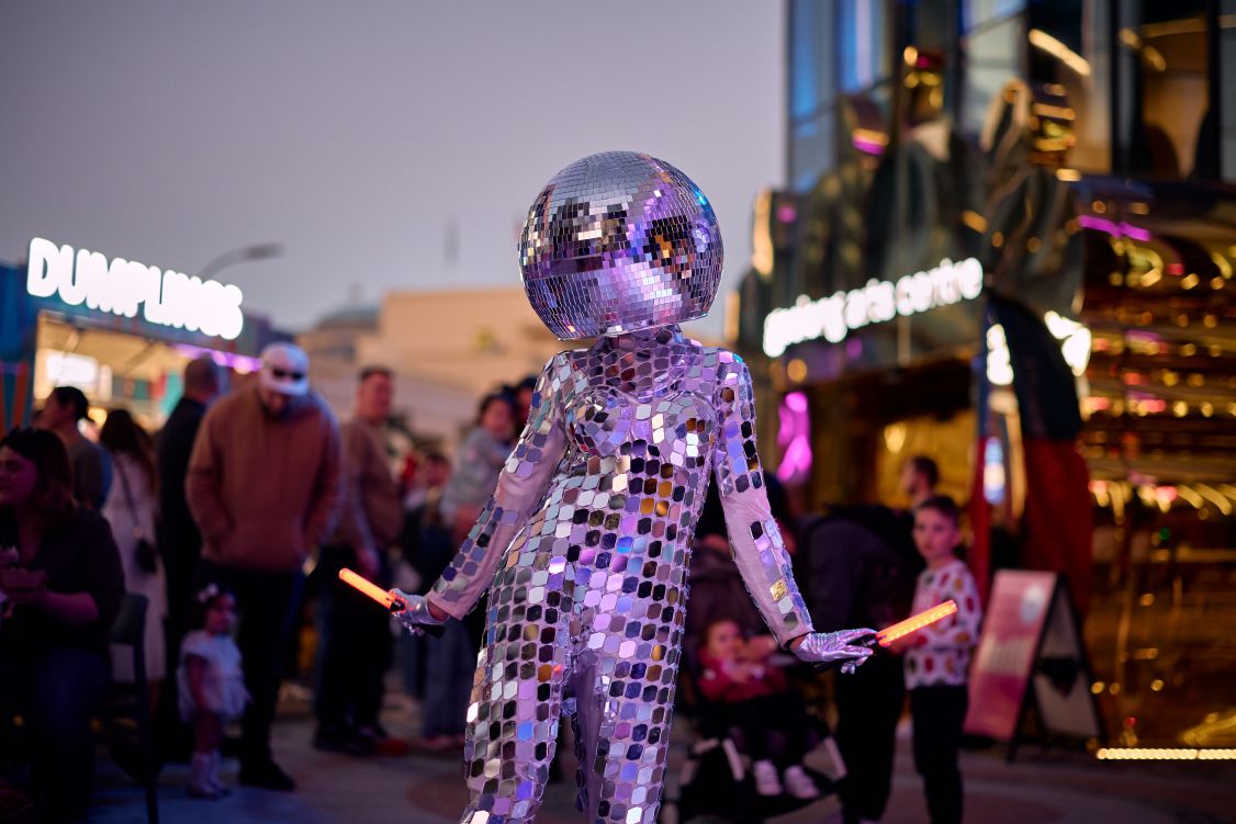 woman in disco ball suit